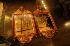 Pair of Italian Baroque Style Cherub Mirrors in Terra Cotta Tones and Parcel Gilt